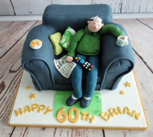 80th Birthday Cake With Figure Sat On Sofa - Mel's Amazing Cakes